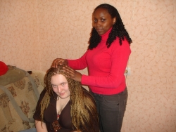 my sister from Zambia her name is Chichi hellping me with my new hair style