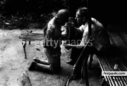 A priest blesses a Biafran man during the civil war in Biafra (now part of Nigeria), 1969
