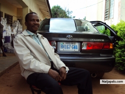 GEORGE POSING WITH TOYOTA CAMRY