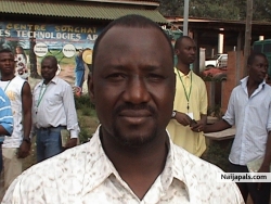 behind him in blue shirt is Kolade