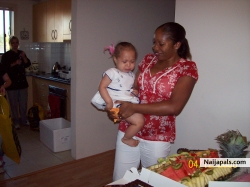 me and amara cutting her 1st b/day cake! not a happy camper...