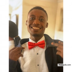 Kaseun Albert styled in red tie and a white shirt