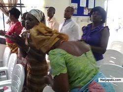 A sister praising God for the live worship at Glorious Word ministries
