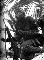 1968 - A Biafran soldier in the bush on alert before the invasion of Abagana