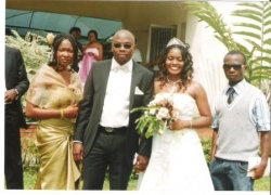 my cousin Nkem & wife Chinelo on their wedding day , his younger sist Dolly on d other side. my dark glasses got lost just after dat shot i don't know how