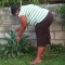 Taking care of my flower in my front yard