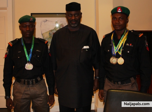 Governor of Cross River State shows appreciation for medal won at a National Championship outing - click for next photo