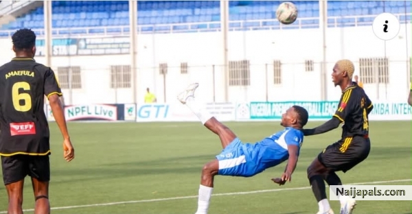 Okere Daniel in action against Kun Khalifa - click for next photo
