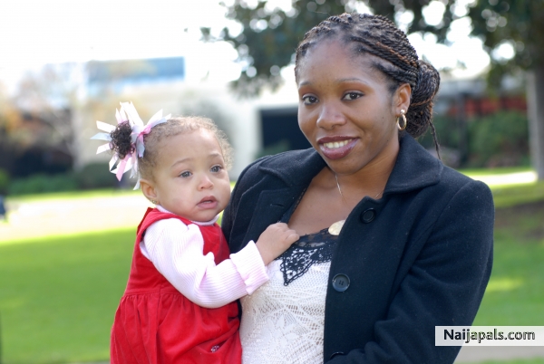 me and my daughter amara at my nieces christening.. - click for next photo