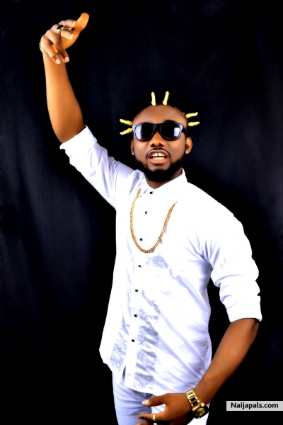 HRM Ozo Prince Chukwubuzor Mba (Ozo Akajiofor Igbo II, Ozo Ementaemeimo 1) known as Don Prince Demonstrating his Sampe - click for next photo