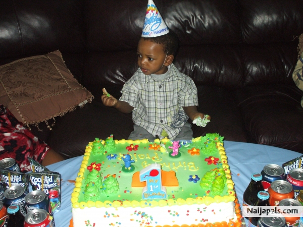 bday boy messin up his cake - click for next photo