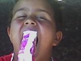 my son nathanael stuffing a popcicle in his mouth - click for next photo