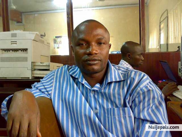 Etim and colleague in the office - click for next photo