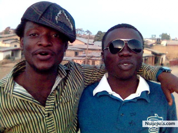 Myself (James) on cap with a friend (Philemon Adang) dark goggles (Safety glasses) in a Nigerian Gheto.... - click for next photo