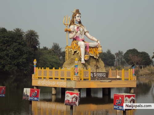 http://ijiya.com/8235807 - Lord Shiva statue at Chandrika Devi, Lucknow, Uttar Pradesh, India. God Shiv Statue in the water of Pond. - click for next photo