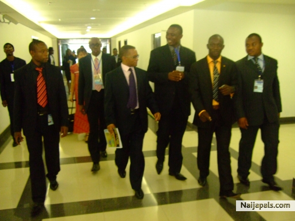 Dr Benard Etta,H.E David Phiri, Deputy minister of finance and national planning zambia, Jerry Blenman, Director Caladid Financial center Babardos and protocool team walking out of the vision 2010 global leadership conference center Yaounde Cameroon - click for next photo
