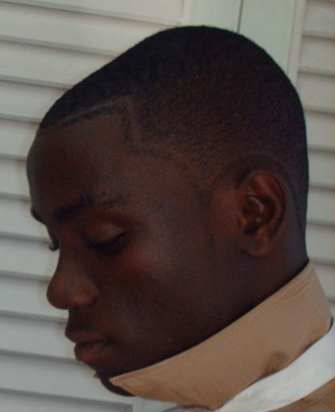 Me knotting my tie, getting set for prom. - click for next photo
