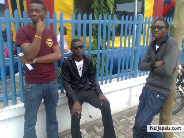 am d 1 sitting putting on a black lng sleve shirt. - click for next photo