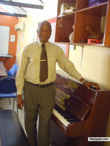 Myself standing beside a piano after playing the piano - click for next photo