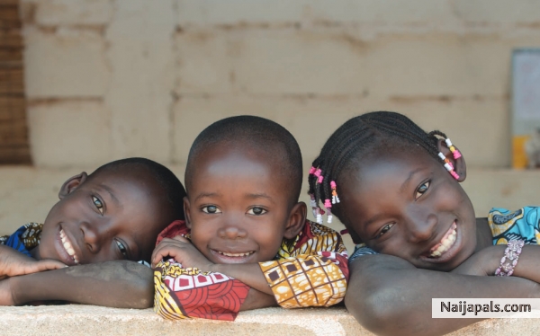 one of the Benin children coming to play > > - click for next photo