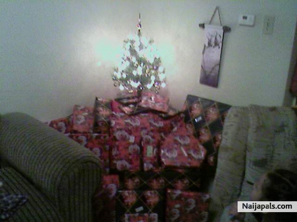 EDWARD JR' S IDEA OF WRAPPING GIFTS, WITH THE SAME WRAPPING PAPER, LOL - click for next photo