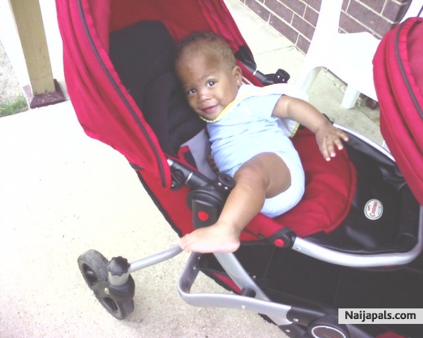 darius trying to climb out of his stroller at 10months now - click for next photo