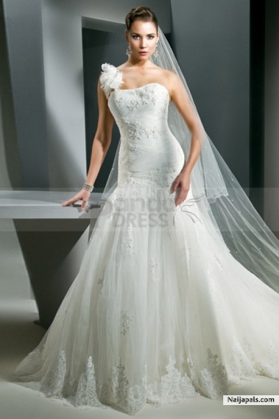 You will undoubtedly be one of the best dressed brides in this soft chiffon mermaid wedding gown. Trendy hammered dress features one shoulder hand and dipped neckline with distinctive applique detail offering the flattering look, while refined dress with lace motif beautifully drapes over the body completing the elegant look and feeling. - click for next photo