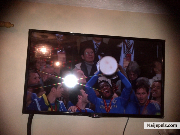 mikel obi lifts european cup! its all blue - click for next photo