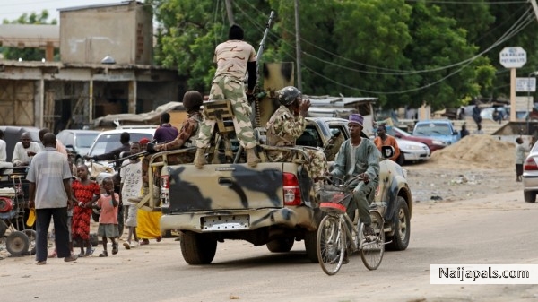 my bicycle arrives through river Naija - click for next photo