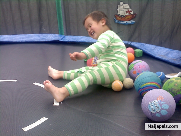 aziah playing on the trampoine - click for next photo