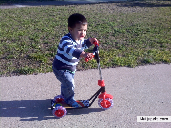 aziah on his scooter - click for next photo