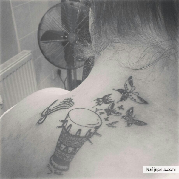 My latest tattoo, talking drum, butterflies and musical notes... - click for next photo