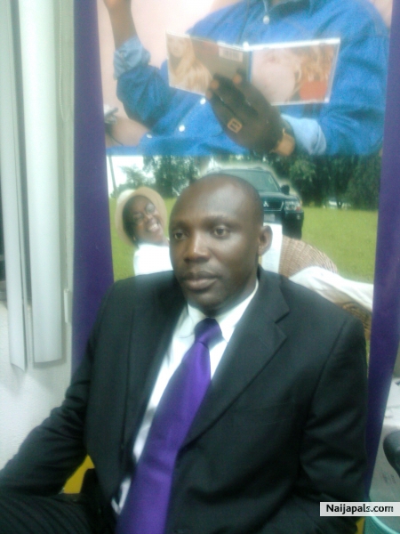Adegboyega in the office - click for next photo