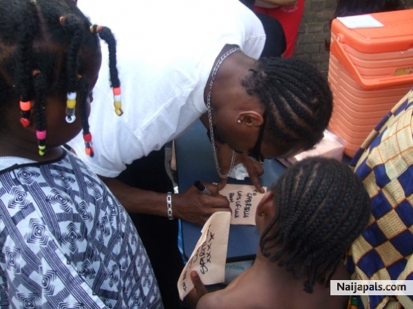 SpiritMan signing autographs for kids - click for next photo