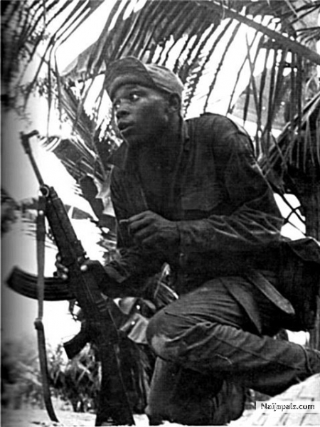 1968 - A Biafran soldier in the bush on alert before the invasion of Abagana - click for next photo