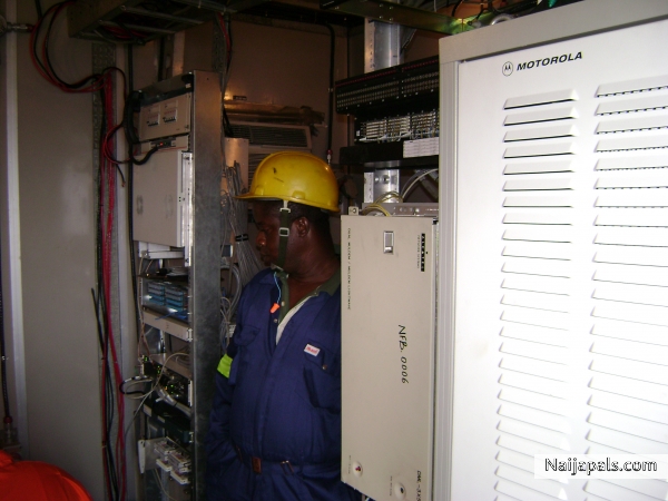 carrying a routine maintenance on a telecoms equipments . - click for next photo